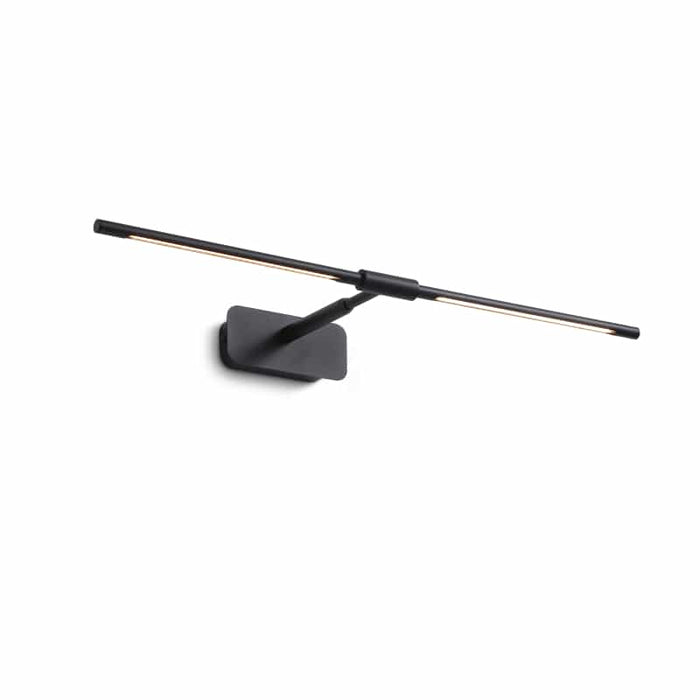 black bathroom sconce over mirror mounted on a white wall