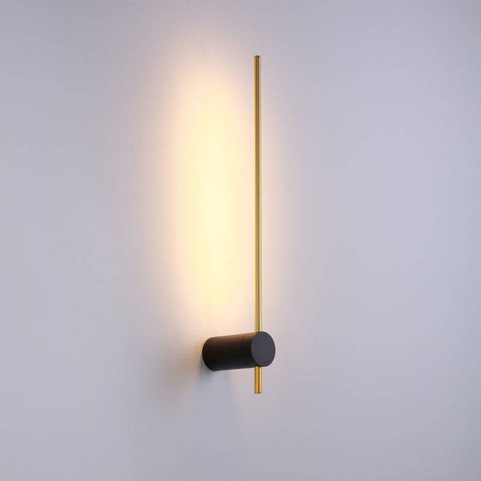 Black and gold interior LED wall sconce on  white background