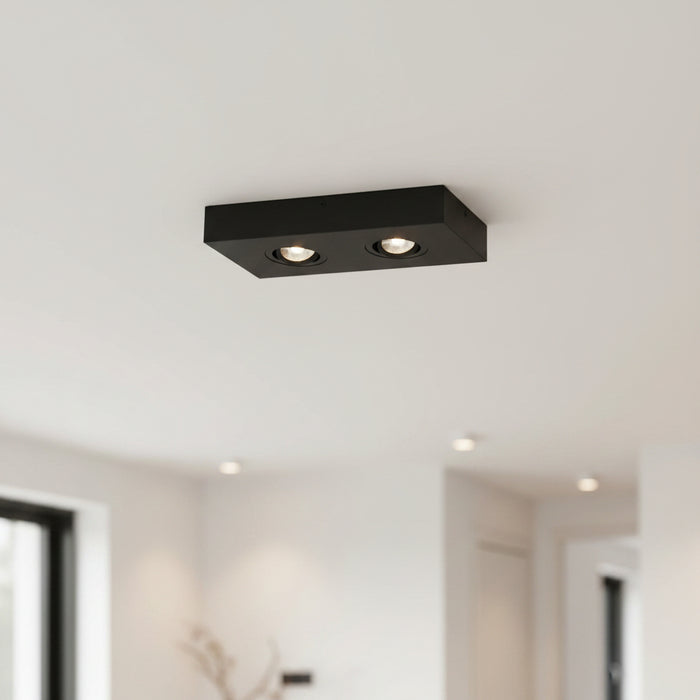 black slim surface mount LED downlight installed in a modern home