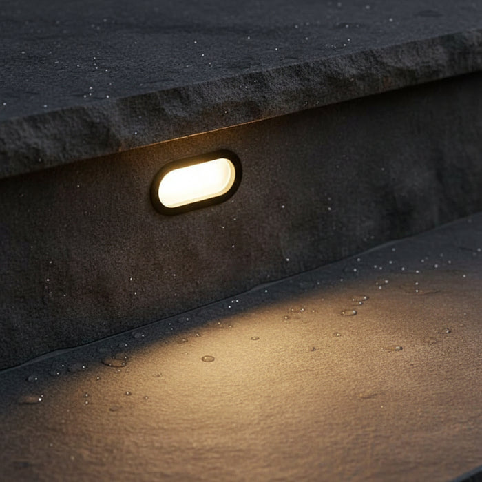 6 watt black oval recessed exterior wall light installed on an exterior step