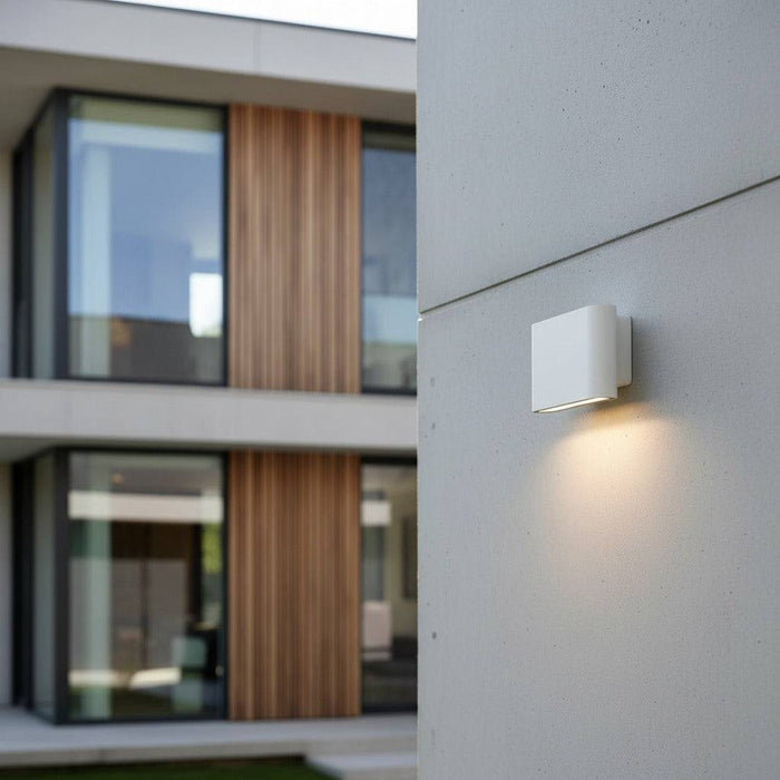 white outside wall downlight mounted on the wall outside a modern home