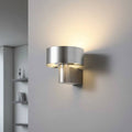 Silver finish interior lantern wall sconce on a neural coloured wall in a modern home
