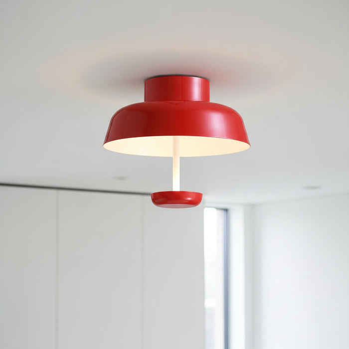 red modern semi flush ceiling light mounted in a modern home