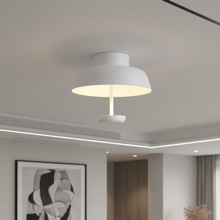 white flush mount ceiling light mounted in a modern home