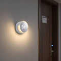illuminated hotel room number sign mounted next to a hotel door
