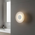 white IP65 bathroom wall sconce mounted on the wall in a modern bathroom