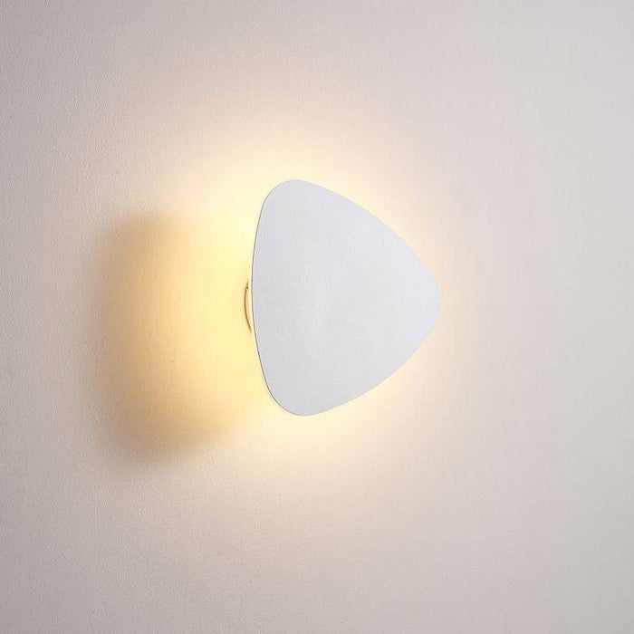 white wall mounted vanity light mounted on a white wall