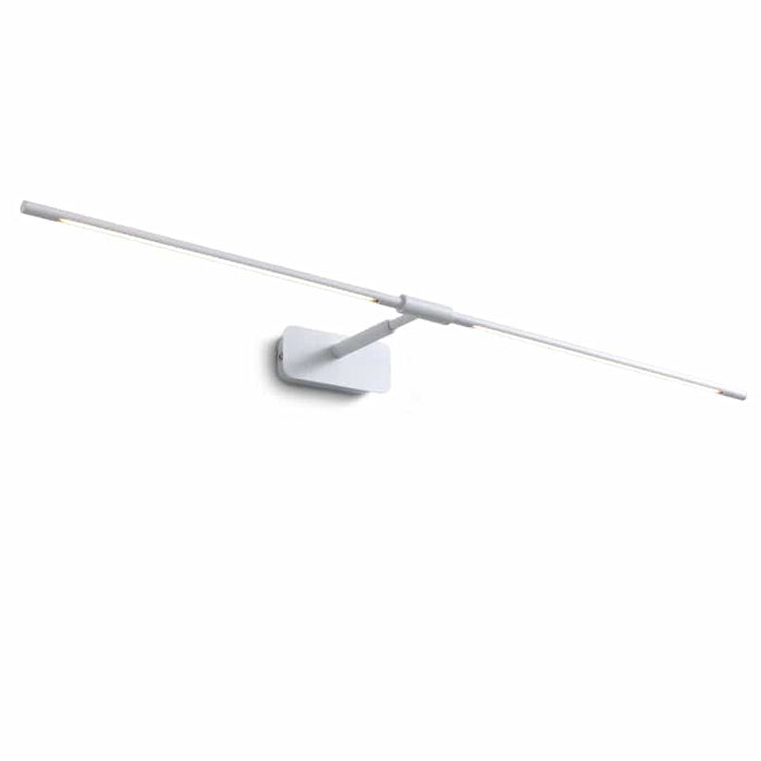 white bathroom light fixture over mirror mounted on a white wall