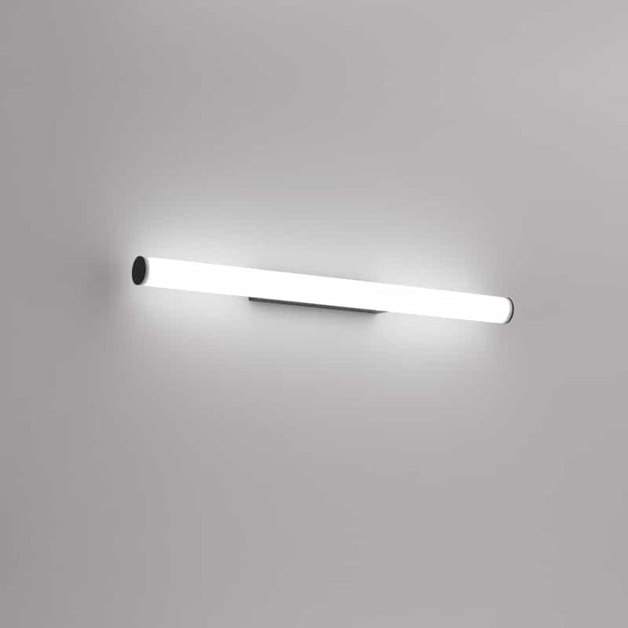 black mirror wall light mounted on a white wall