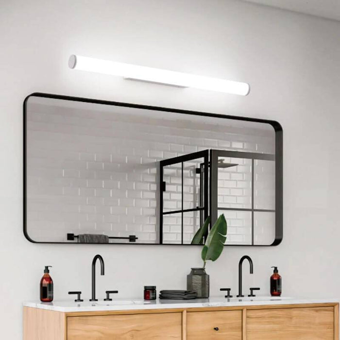 white bathroom vanity mirror light mounted over a bathroom mirror