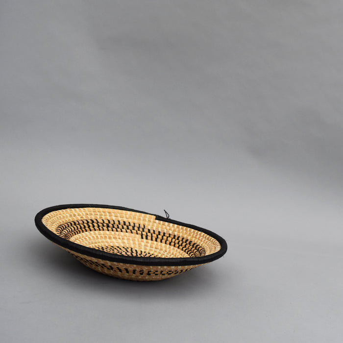 Hand woven straw. A tradition and art which has been part of Ugandan culture for centuries.  With all of the materials used being natural products or recycled, we also believe this is a lovely way of making use of natural resources the world has to offer and making positive changes to become more sustainable.  Beautifully, unique, handmade basket made out of banana stalks and raffia fibres also known as the Ugandan basket.