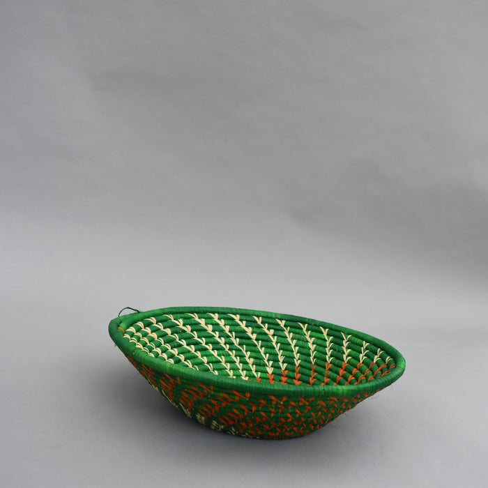 Hand woven straw. A tradition and art which has been part of Ugandan culture for centuries.  With all of the materials used being natural products or recycled, we also believe this is a lovely way of making use of natural resources the world has to offer and making positive changes to become more sustainable.  Beautifully, unique, handmade basket made out of banana stalks and raffia fibres also known as the Ugandan basket.
