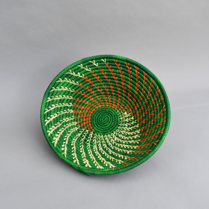 Hand woven straw. A tradition and art which has been part of Ugandan culture for centuries.  With all of the materials used being natural products or recycled, we also believe this is a lovely way of making use of natural resources the world has to offer and making positive changes to become more sustainable.  Beautifully, unique, handmade basket made out of banana stalks and raffia fibres also known as the Ugandan basket.