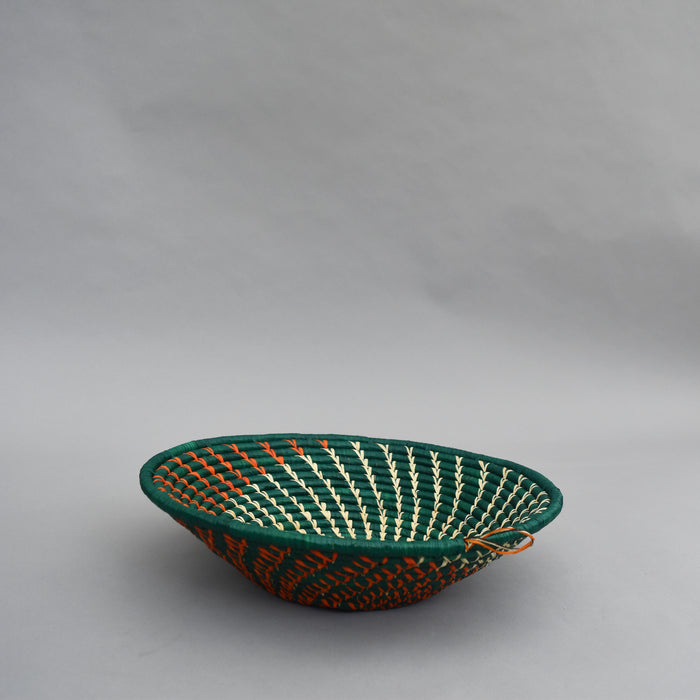 Hand woven straw. A tradition and art which has been part of Ugandan culture for centuries.  With all of the materials used being natural products or recycled, we also believe this is a lovely way of making use of natural resources the world has to offer and making positive changes to become more sustainable.  Beautifully, unique, handmade basket made out of banana stalks and raffia fibres also known as the Ugandan basket.