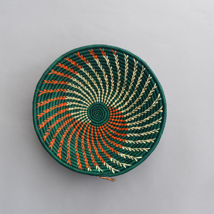 Hand woven straw. A tradition and art which has been part of Ugandan culture for centuries.  With all of the materials used being natural products or recycled, we also believe this is a lovely way of making use of natural resources the world has to offer and making positive changes to become more sustainable.  Beautifully, unique, handmade basket made out of banana stalks and raffia fibres also known as the Ugandan basket.