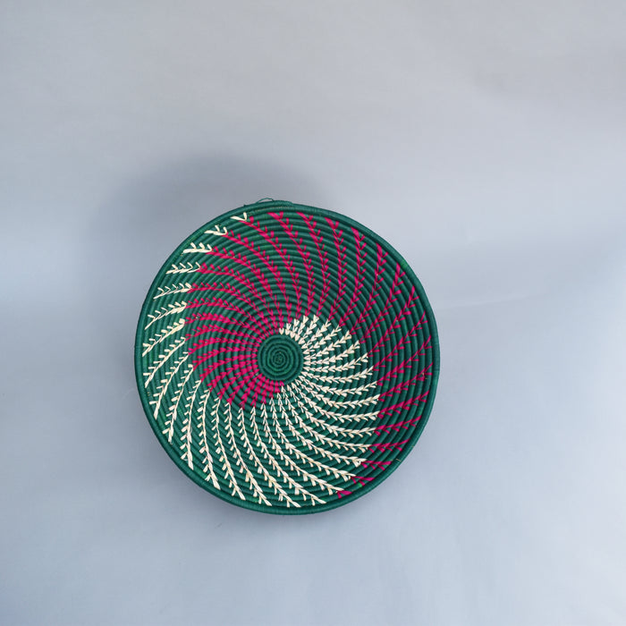 Hand woven straw. A tradition and art which has been part of Ugandan culture for centuries.  With all of the materials used being natural products or recycled, we also believe this is a lovely way of making use of natural resources the world has to offer and making positive changes to become more sustainable.  Beautifully, unique, handmade basket made out of banana stalks and raffia fibres also known as the Ugandan basket.