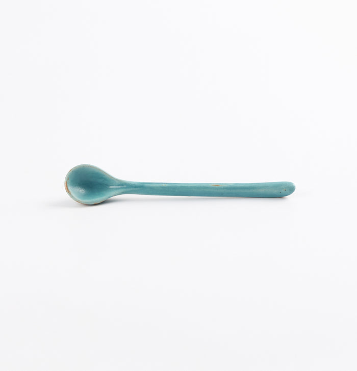 Antique teal blue and green teaspoon by Palinopsia Ceramics on a white background