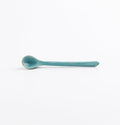 Antique teal blue and green teaspoon by Palinopsia Ceramics on a white background