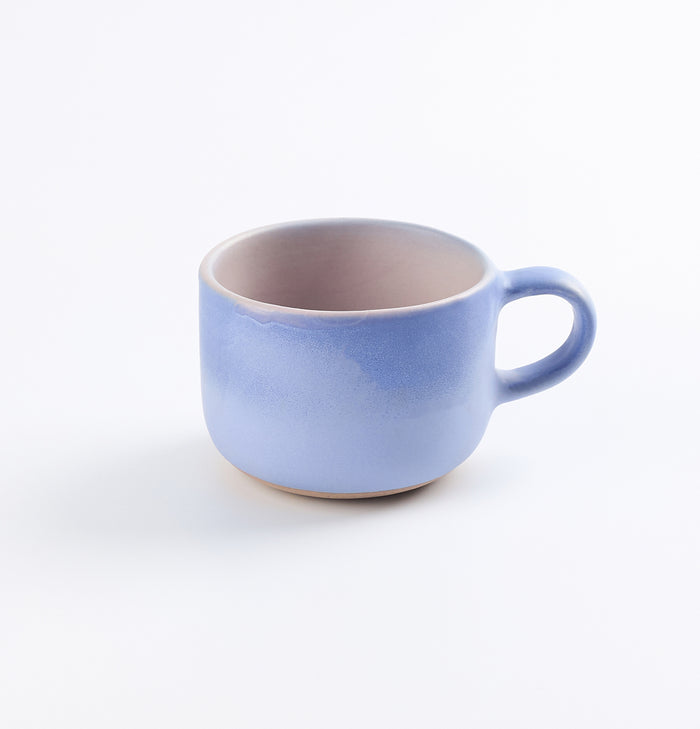 Baby blue mug with pink on white background