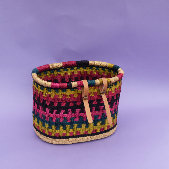 The perfect fair-trade accessory you need for your bike to help carry items freely, be it a little shopping or bits and bubs. It comes with a faux leather strap so that it can be fitted on the bike. It’s colorful, stylish and most importantly eco-friendly and It doesn’t matter if it gets wet. All you need to do is dry it in airy place. It is easy to strap and unstrap onto the bike as and when needed.  The basket is made of Elephant grass in Bogla, Ghana. It is environmentally friendly, 100% degradable, and