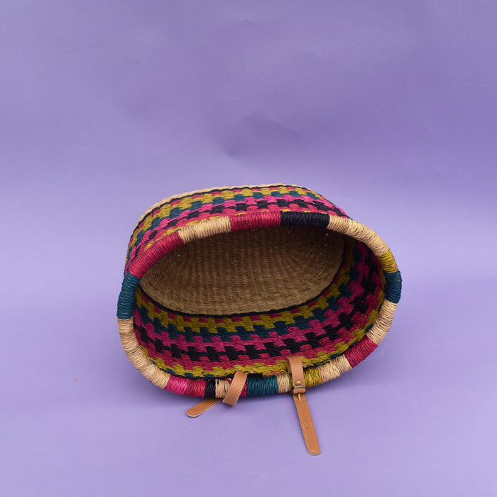The perfect fair-trade accessory you need for your bike to help carry items freely, be it a little shopping or bits and bubs. It comes with a faux leather strap so that it can be fitted on the bike. It’s colorful, stylish and most importantly eco-friendly and It doesn’t matter if it gets wet. All you need to do is dry it in airy place. It is easy to strap and unstrap onto the bike as and when needed.  The basket is made of Elephant grass in Bogla, Ghana. It is environmentally friendly, 100% degradable, and