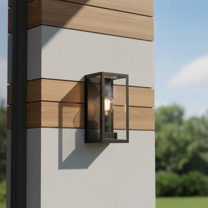 black outdoor wall sconce mounted on a modern home exterior wall