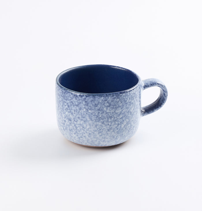 Palinopsia ceramic midnight blue and white blizzard handmade mug on white background