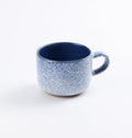 Palinopsia ceramic midnight blue and white blizzard handmade mug on white background