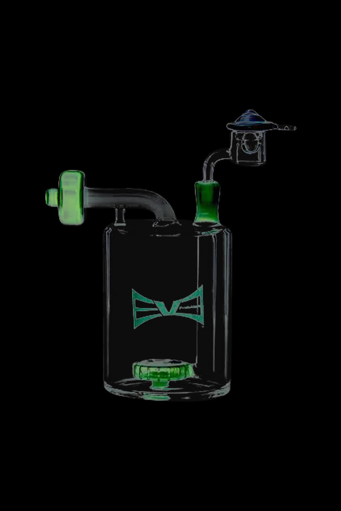 A three-quarter view of the Evolution Money Jar Dab Rig with Banger and Carb Cap, showcasing its clear glass construction and unique jar shape.
