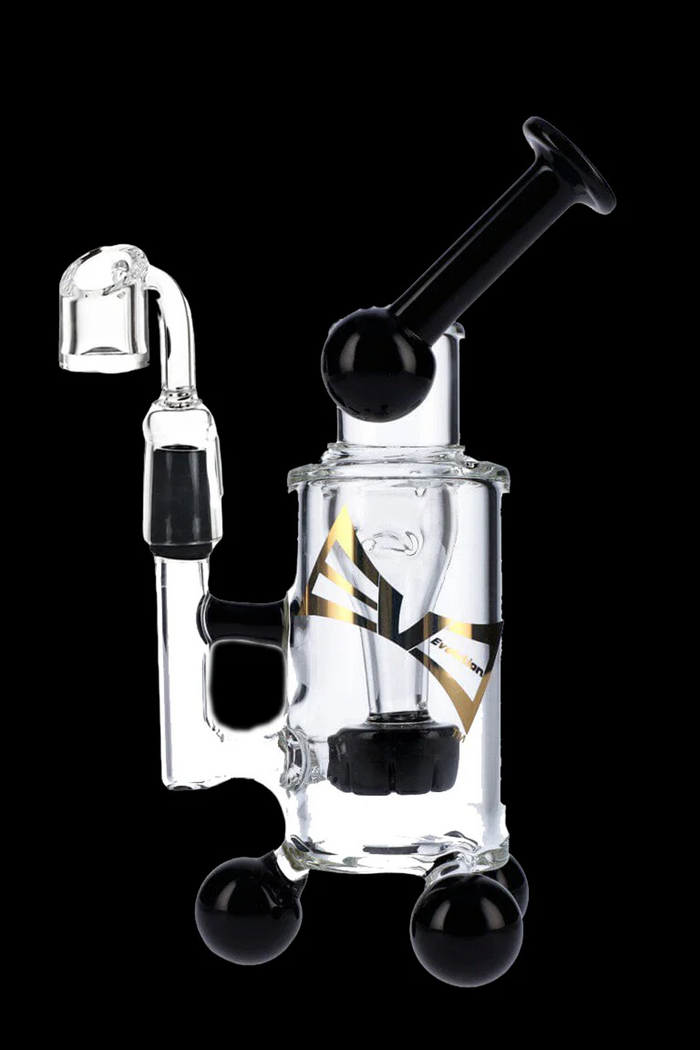 Clear glass dab rig with black accents and spherical bases.