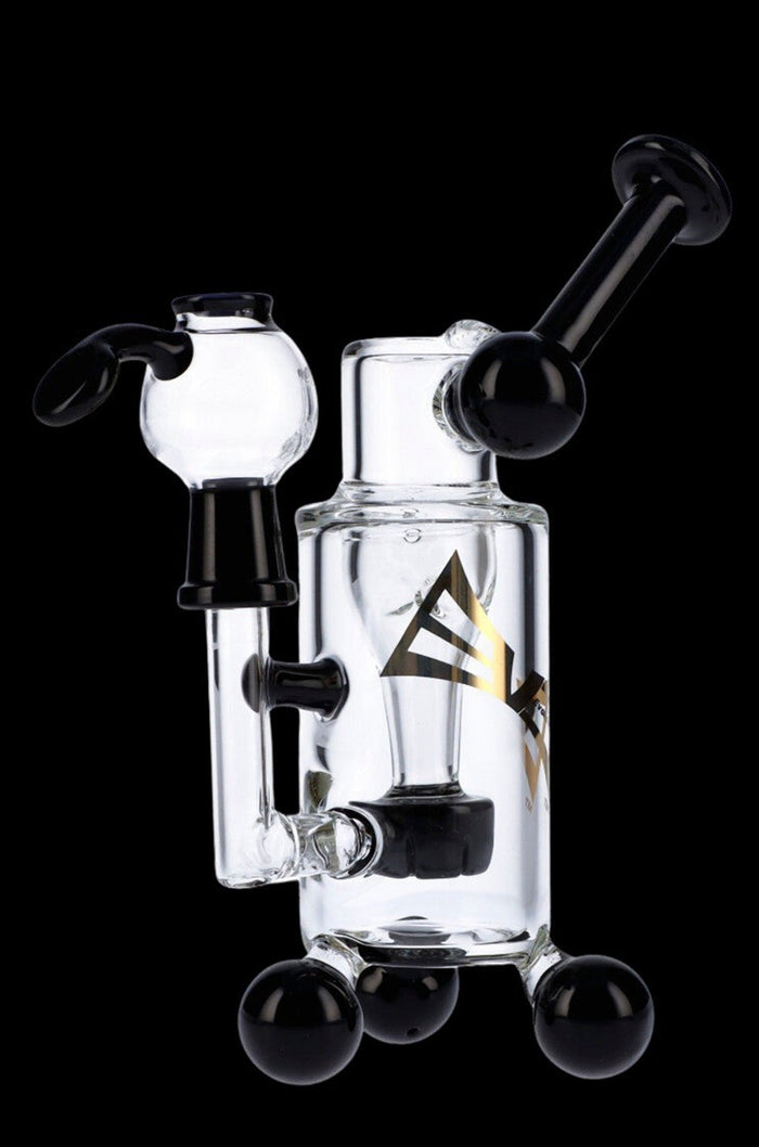 Clear glass water pipe (rig) with black accents and spherical base, studio shot.