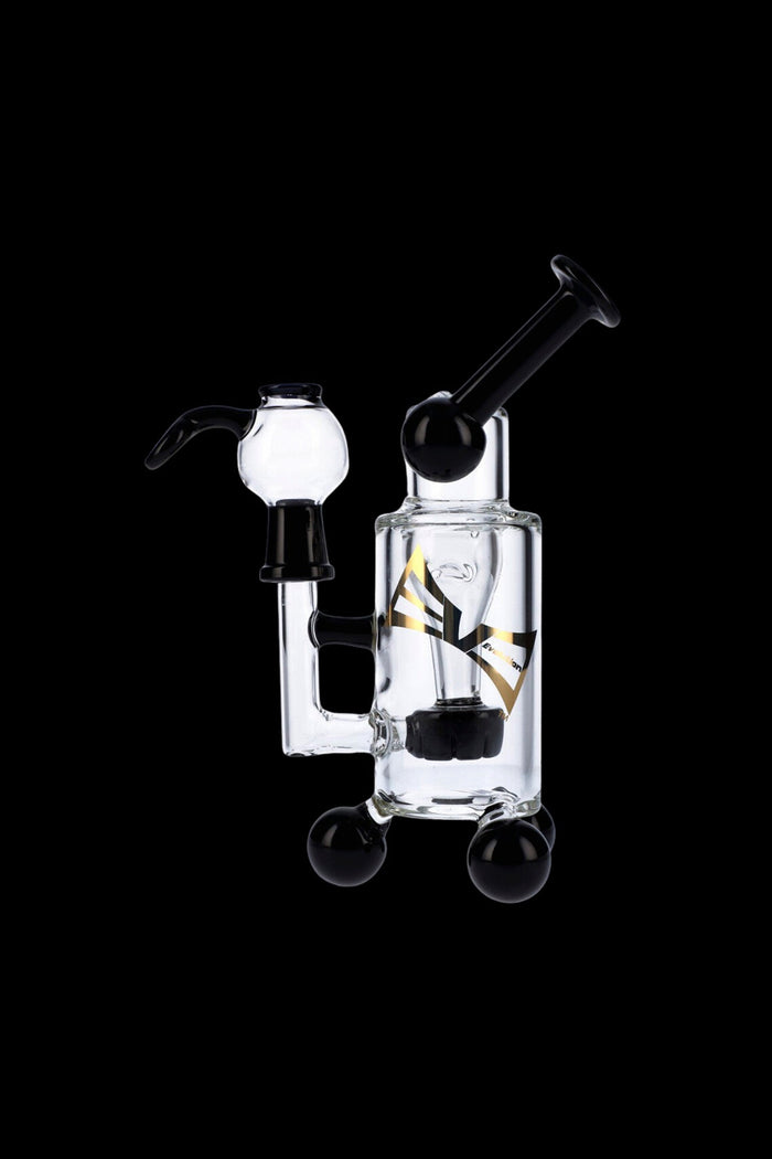 Clear glass water pipe (rig) with black accents, featuring a percolator and mouthpiece, isolated on a black background.