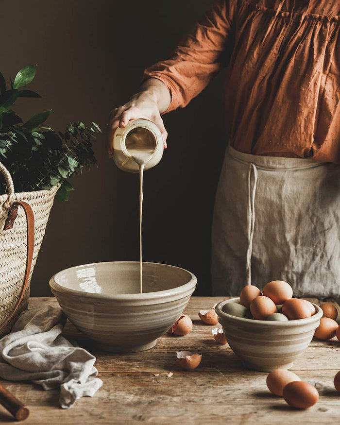 Farmhouse Yellowware Stoneware Mixing Bowl — pouring into a Yellowware bowl; Farmhouse Pottery