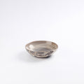 Handmade ceramic breakfast bowl with marbled design on a white background