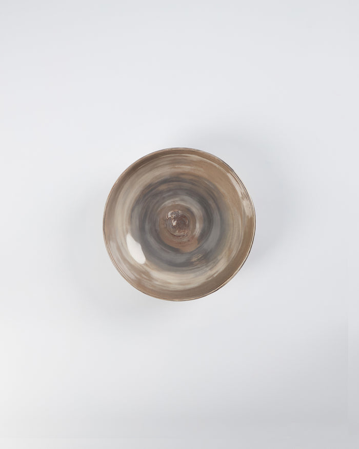 Ceramic bowl with a four colour marbled clay pattern on a white background by Palinopsia