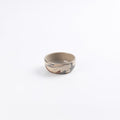Pickle dish ceramic small bowl with marbled clay design and detail on a white background