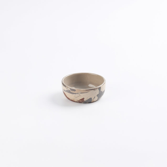 Pickle dish ceramic small bowl with marbled clay design and detail on a white background