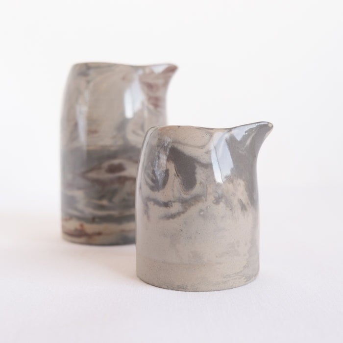 Set of two ceramic hand pitchers with marble design