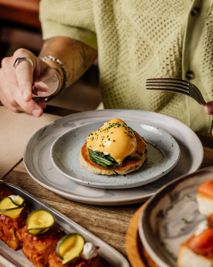 Brunch with a ceramic Maya bread plate with Eggs Benedict at Autumn Rooms on Darby Street