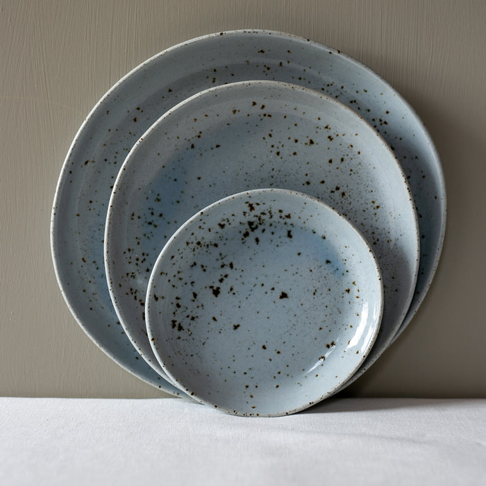 stacked 3 piece dinner set by Palinopsia Ceramics in a blue speckle glaze
