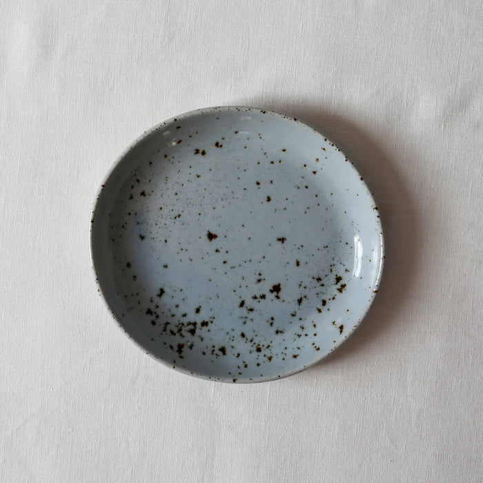 Bird's-eye view of Organic light blue speckled side plate by Palinopsia Ceramics