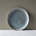 Handmade Maya lunch plate by Palinopsia leaning on a wall