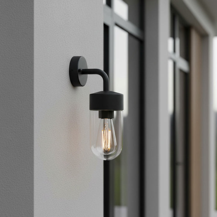 black lantern outside light installed on a grey exterior wall