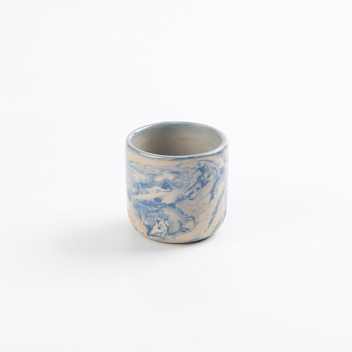Ceramic espresso cup with marbled abstract design in cobalt blue and white by Palinopsia