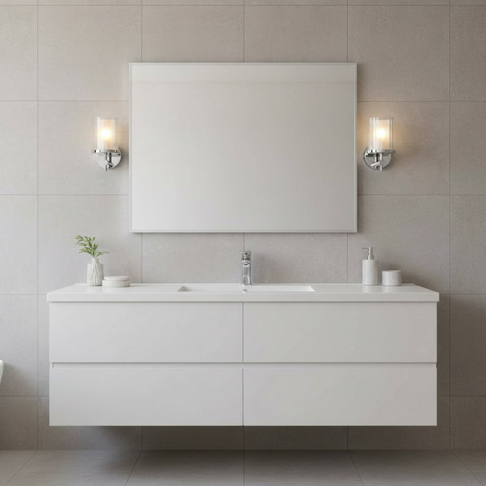polished chrome bathroom wall light mounted either side of a mirror in a bathroom