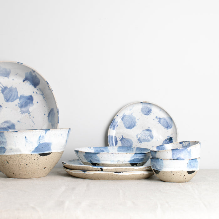Palinopsia's Pollock collection against a white background showing the artistic dinner set in a  blue and white design