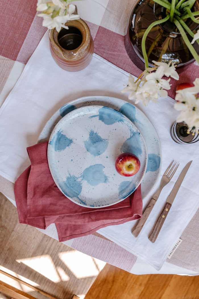 Dining table with handmade dinner set in blue and white by Palinopsia Ceramics