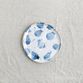 Bird's-eye view of a handmade lunch plate by Palinopsia Ceramics in a blue and white design