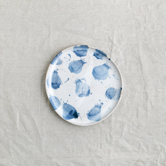 Bird's-eye view of a handmade lunch plate by Palinopsia Ceramics in a blue and white design