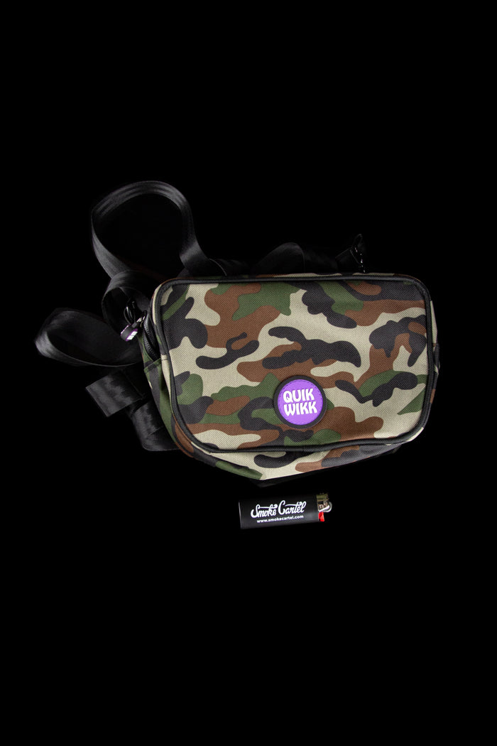 Top-down view of a White Camo Quik Wikk Chest Pack with a purple circular logo, black straps coiled against a black background